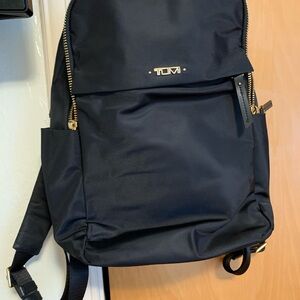 2 tumi back pack in new condition. Used twice..